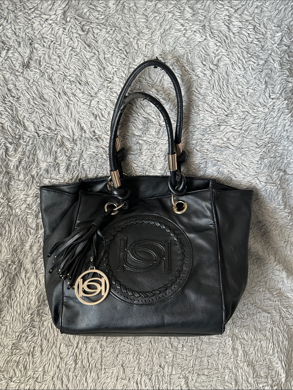 bebe Black Leather Tote with Braided Medallion and Tassel